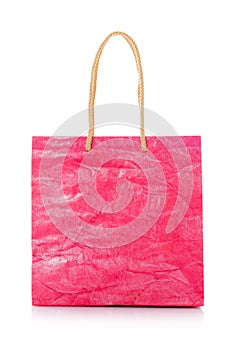 Pink nacre gift bag with raised handles. Isolated on a white background.