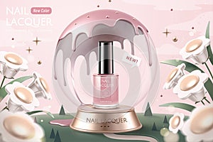 Pink nail lacquer in snow globe ads photo