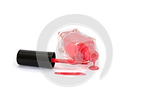 Pink nail polish isolated on a white background. Women`s cosmetics.