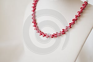 Pink necklace with red beads