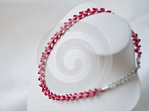 Pink necklace with red beads
