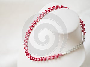 Pink necklace with red beads