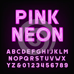 Pink neon tube alphabet font. Type letters and numbers on a dark background.