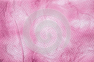 Pink nonwoven fabric texture background