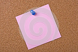 Pink note with blue pin