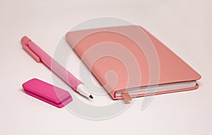 Pink note pad and pencil, soft focus. Notebook, organizer, diary for planning, memo or sketching