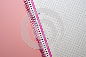 Pink notebook on pink background photo