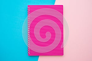Pink notepad on pink blue background - Business education stationery