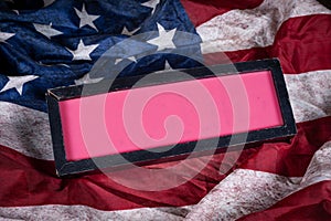 Pink Notice Board on United States flag in background