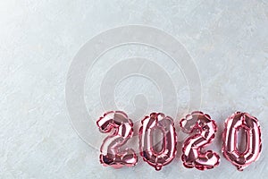 Pink numbers 2020 on a white background.