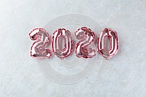 Pink numbers 2020 on a white background.
