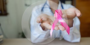 Pink October Breast Cancer Awareness month, doctor with pink ribbon symbol. National cancer survivors month. health care