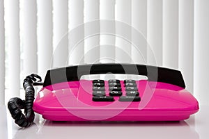 Pink office telephone.