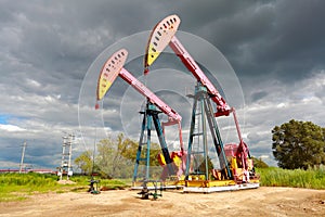 Pink Oil pump oil rig energy industrial machine on the side of d