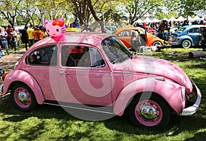 Pink old Volkswagen Beetle Car at Orange Blossom Carnival