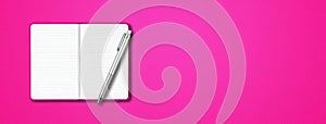Pink open notebook with a pen isolated on colorful background. Horizontal banner