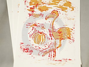 Pink and orange flamingo print on paper