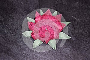 Pink Origami Lotus Flower - Paper Art on Textured Background