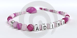 A pink pacifier chain for girls with name Adina