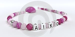 A pink pacifier chain for girls with name Aiko