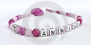 A pink pacifier chain for girls with name Annika