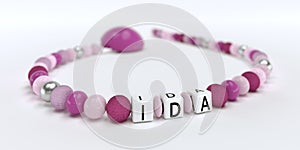 A pink pacifier chain for girls with name Ida