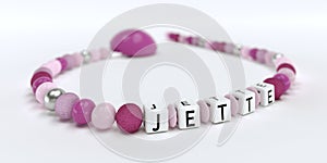 A pink pacifier chain for girls with name Jette