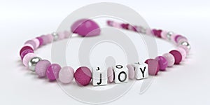 A pink pacifier chain for girls with name Joy