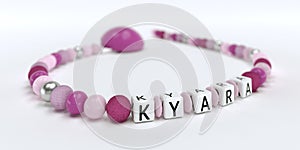 A pink pacifier chain for girls with name Kyara