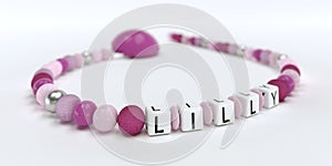 A pink pacifier chain for girls with name Lilly