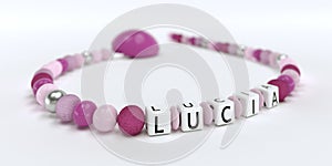 A pink pacifier chain for girls with name Lucia