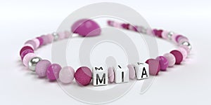 A pink pacifier chain for girls with name Mia