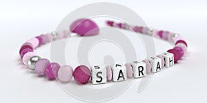 A pink pacifier chain for girls with name Sarah