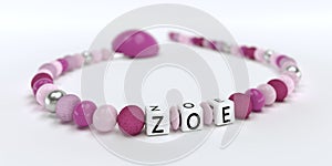 A pink pacifier chain for girls with name Zoe