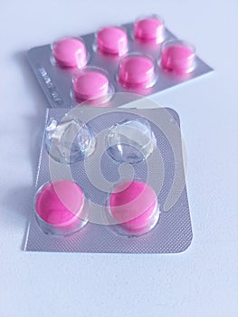 Pink Painkiller Pills in Packaging.