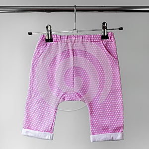 Pink panties for baby. The concept of clothes, motherhood and newborn photo