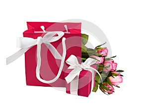 Pink paper bag and gift box with rose flowers