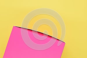 pink paper box on yellow background, package for design