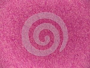 Pink paper fiber texture in close-up