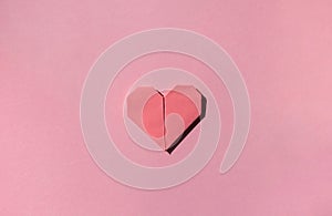 Pink paper origami heart. Valentine\'s day celebration concept