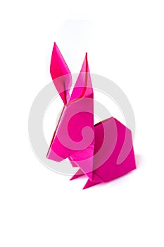 Pink paper rabbit origami isolated on a white background