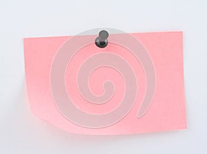 Pink paper sheet pinned