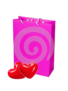 Pink paper shopping bag and two red heart isolated on white