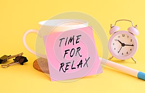 Pink paper with the text TIME FOR RELAX on a white cup. Clock, pen on a yellow background