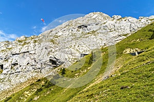 Pink Parasail Rock Cliffs Pastures Climbing Mount Pilatus Lucerne Switzerland photo