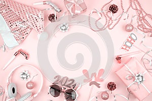 Pink pastel Christmas decoration for New Year`s Eve frame. Modern new year 2020 party banner mockup on pink background with copy