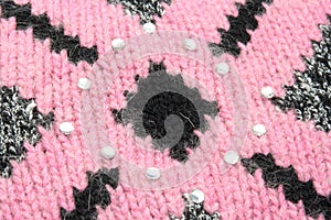 Pink pattern on black sweater