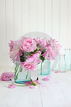 Pink peonies in glass jars