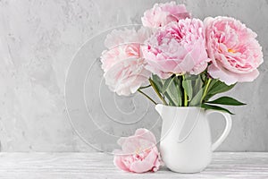 Pink peony flowers bouquet on white background with copy space. still life. womens day or wedding concept photo