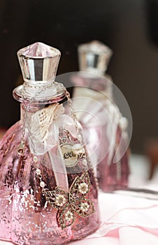 Pink perfume bottle with pendant